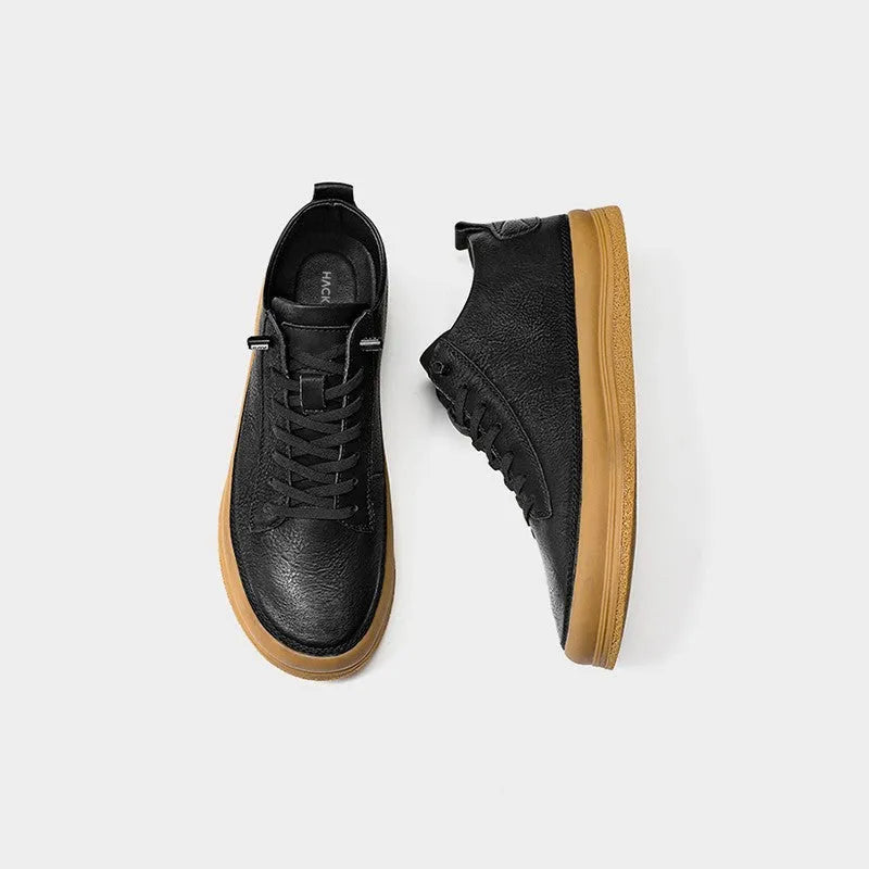 Men's black leather casual shoes with round toe and lace-up closure on a rubber sole