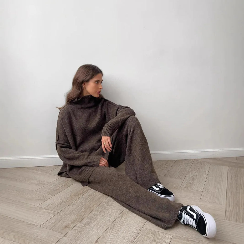 Women's acrylic knit suit set with side-slit sweater and matching trousers in dark gray