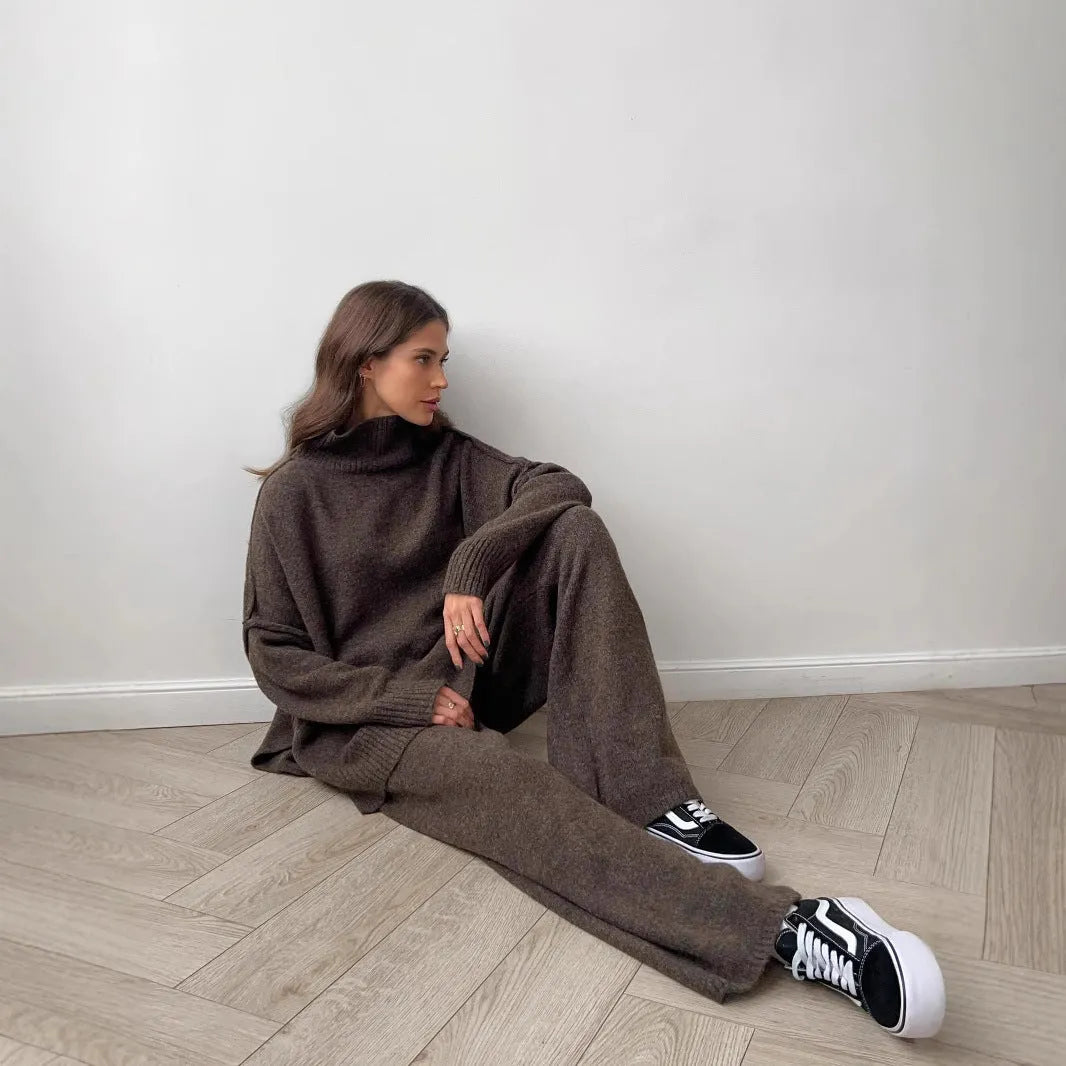 Women's acrylic knit suit set with side-slit sweater and matching trousers in dark gray