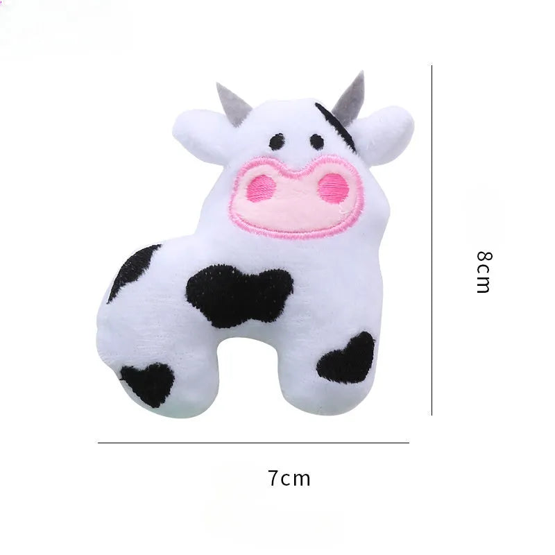 Plush cat toy in shape of cow, crocodile or parrot with catnip filling for interactive play