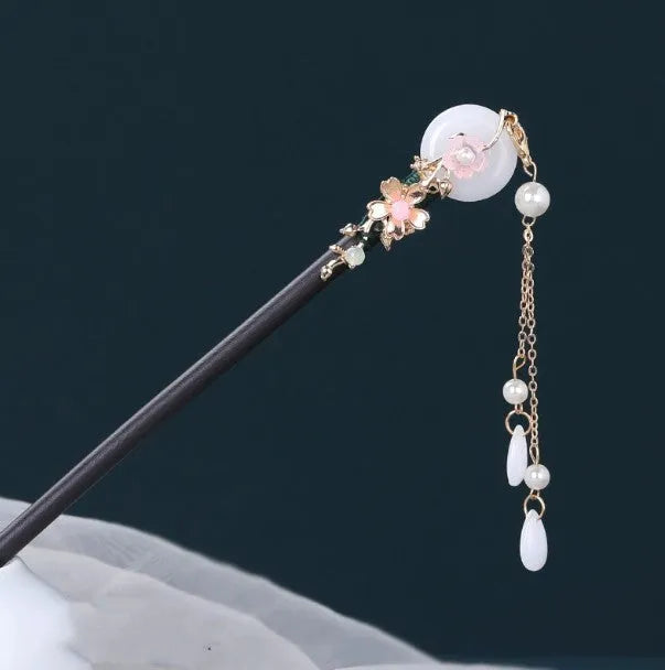 Chinese ancient style floral alloy hairpin with electroplated finish on dark background
