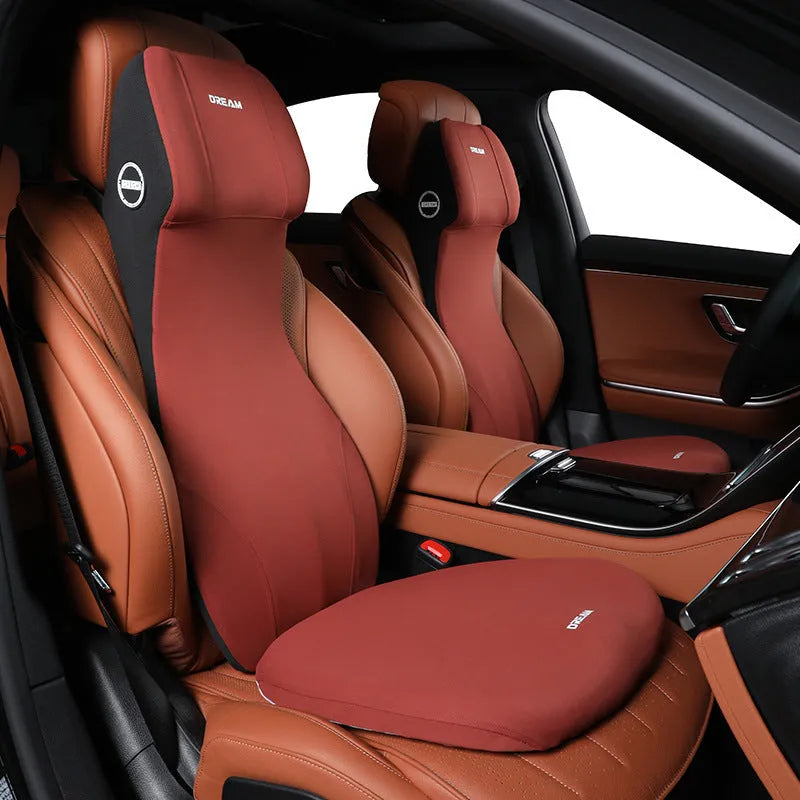 Black integrated memory foam car cushion and lumbar support pillow on a car seat.