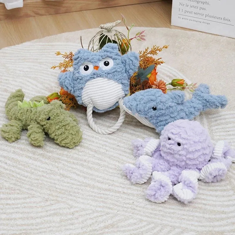 Plush caterpillar fabric dog toy in shark shape with squeaker on white background