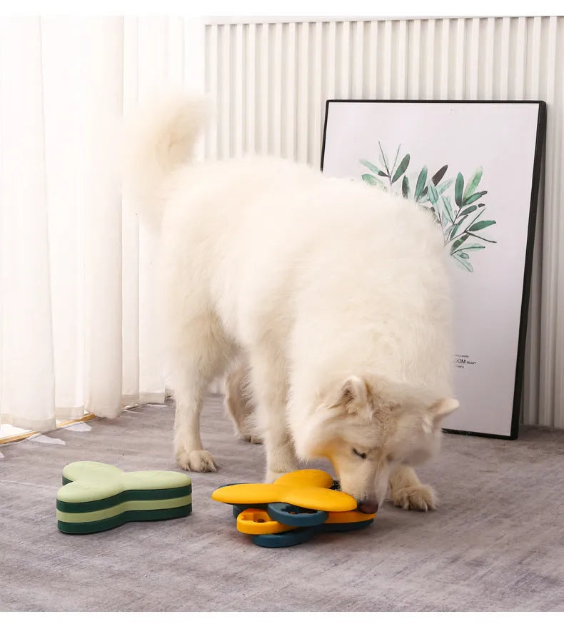 Green dog puzzle toy with bone-shaped covers showing nine compartments for treat dispensing