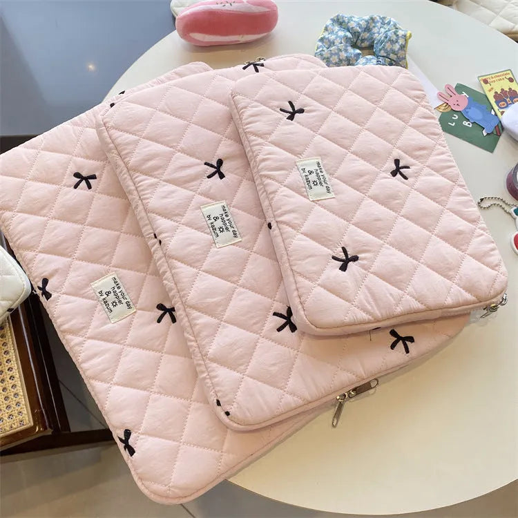 Rhombus embroidered bow design on nylon laptop storage bag showing colour and size options