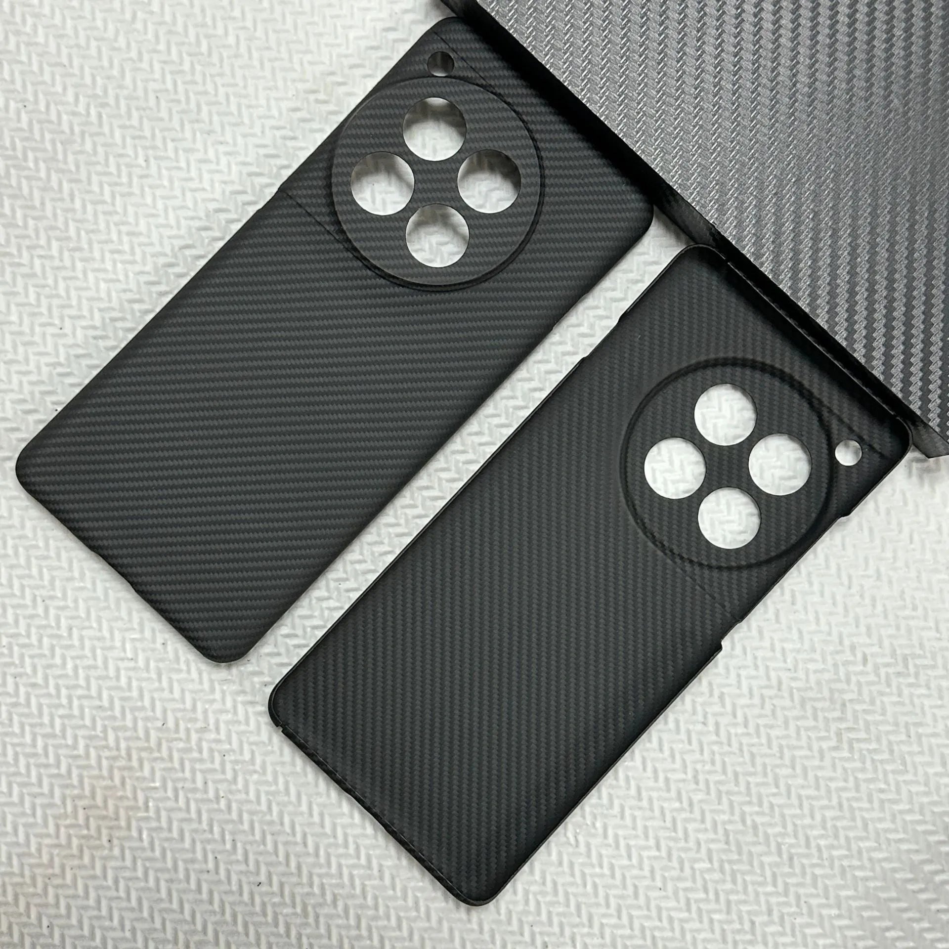 Black hand-woven Kevlar anti-wear phone case for OnePlus 12 with crater texture