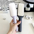 Roland purple self-cleaning hair brush with rotating handle for easy hair removal.