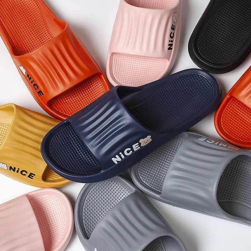 Adult cartoon pattern EVA slippers in multiple colours on a non-slip sole.