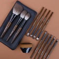 12-piece makeup brush set with wooden handles in black PU roll-up case