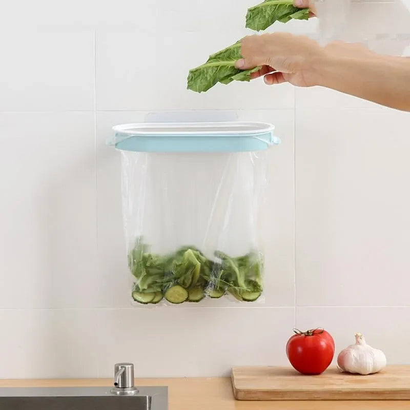 Blue plastic kitchen garbage bag storage rack mounted under a sink