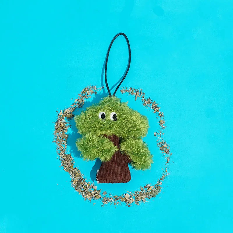 Green pine tree shaped fabric cat toy bag with hanging loop.