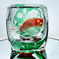 Edo crystal glass whiskey shot glass with carved cylindrical pattern in assorted yellow green
