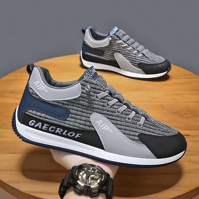 Men's grey and green mesh running shoes with lace-up closure and round toe