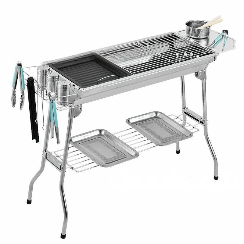 Stainless steel portable barbecue oven with flip design and charcoal cooking accessories