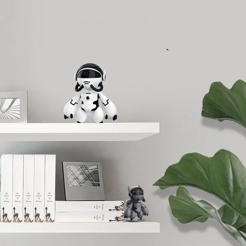 White indoor security camera with wide-angle lens on a detachable stand, for home monitoring.