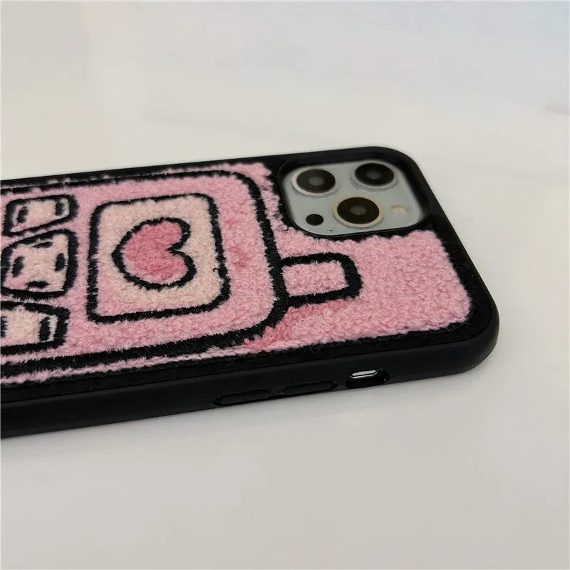 Pink towel embroidered soft TPU back cover case for Apple iPhone mobile phones.