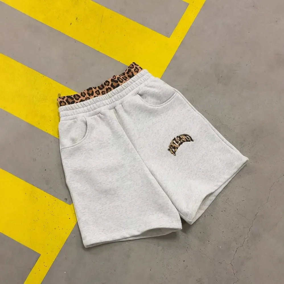 Men's grey patchwork double waist loose hip hop trousers on a white background