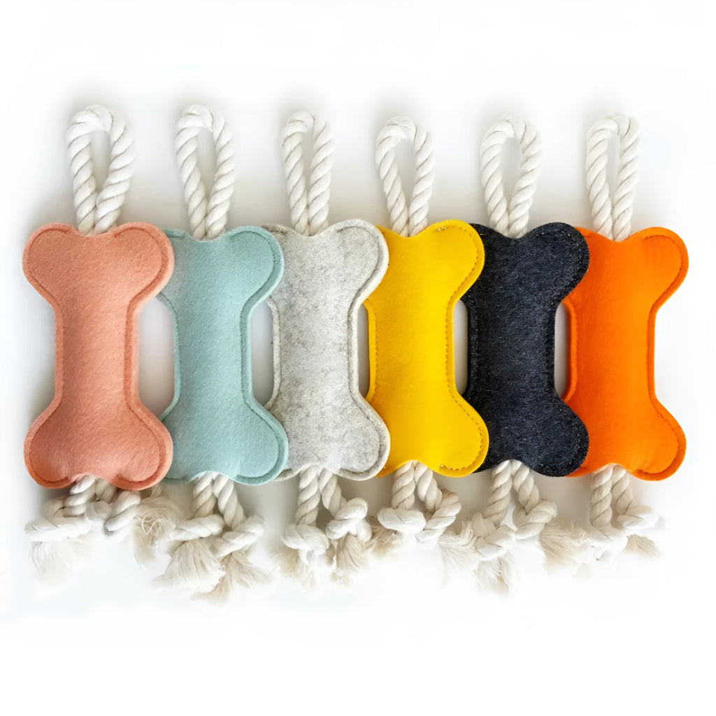 Durable bone-shaped dog rope chew toy with felt cover in four colour options