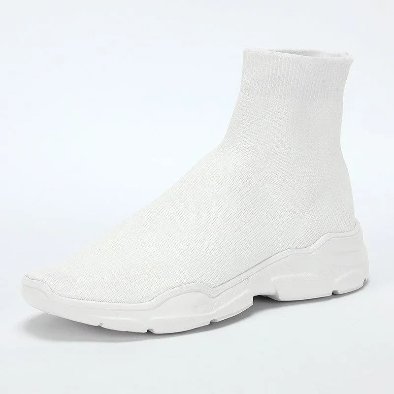 Thick-soled slip-on casual shoes in black with fabric upper, mid-top design, and round toe.