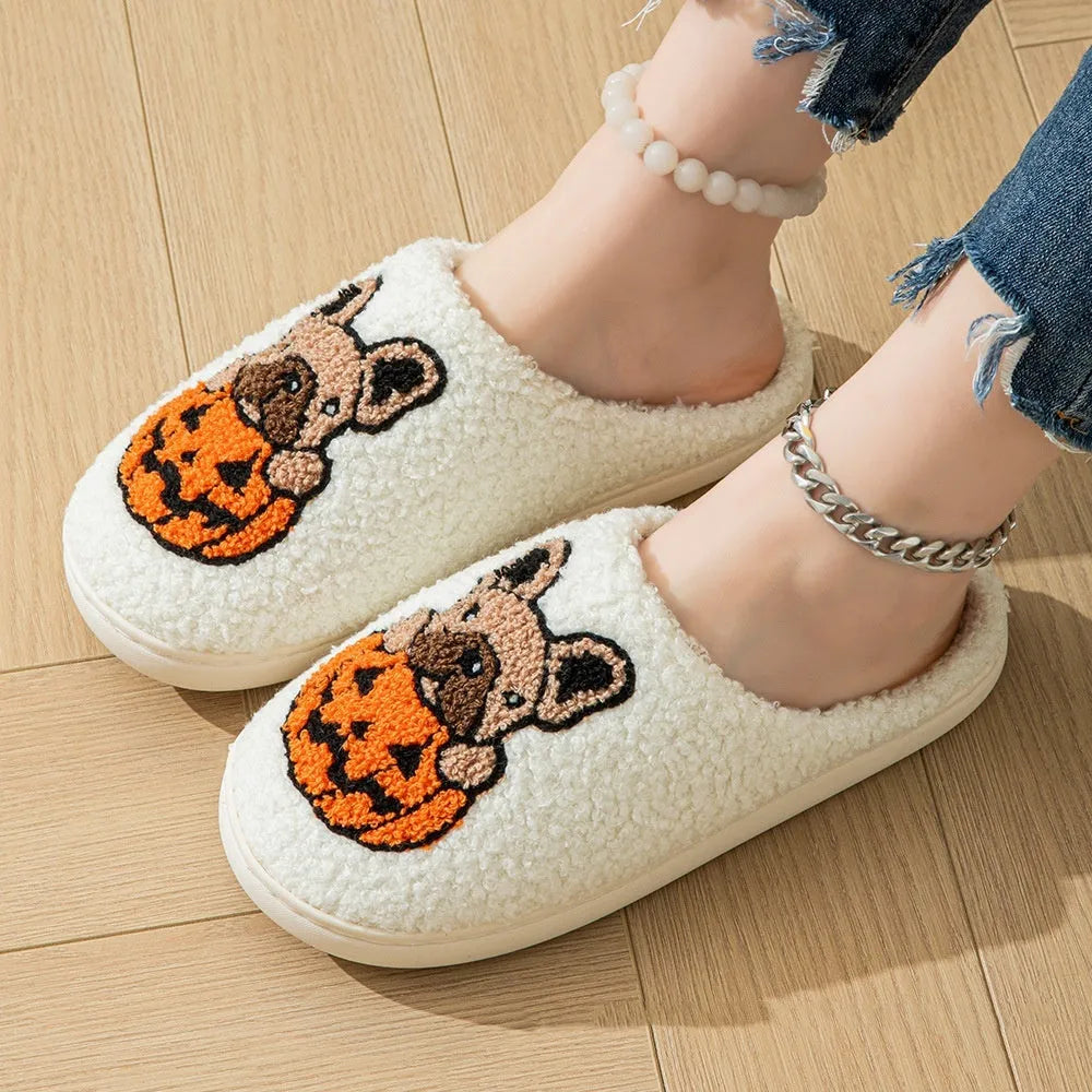 Black and white Halloween pumpkin plush slippers with round toe design and TPR rubber soles