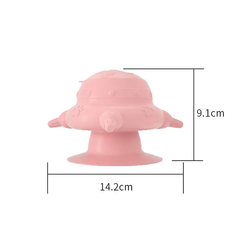 Pink silicone pet nursing bottle with bionic breast design and four pacifiers on a flat base.