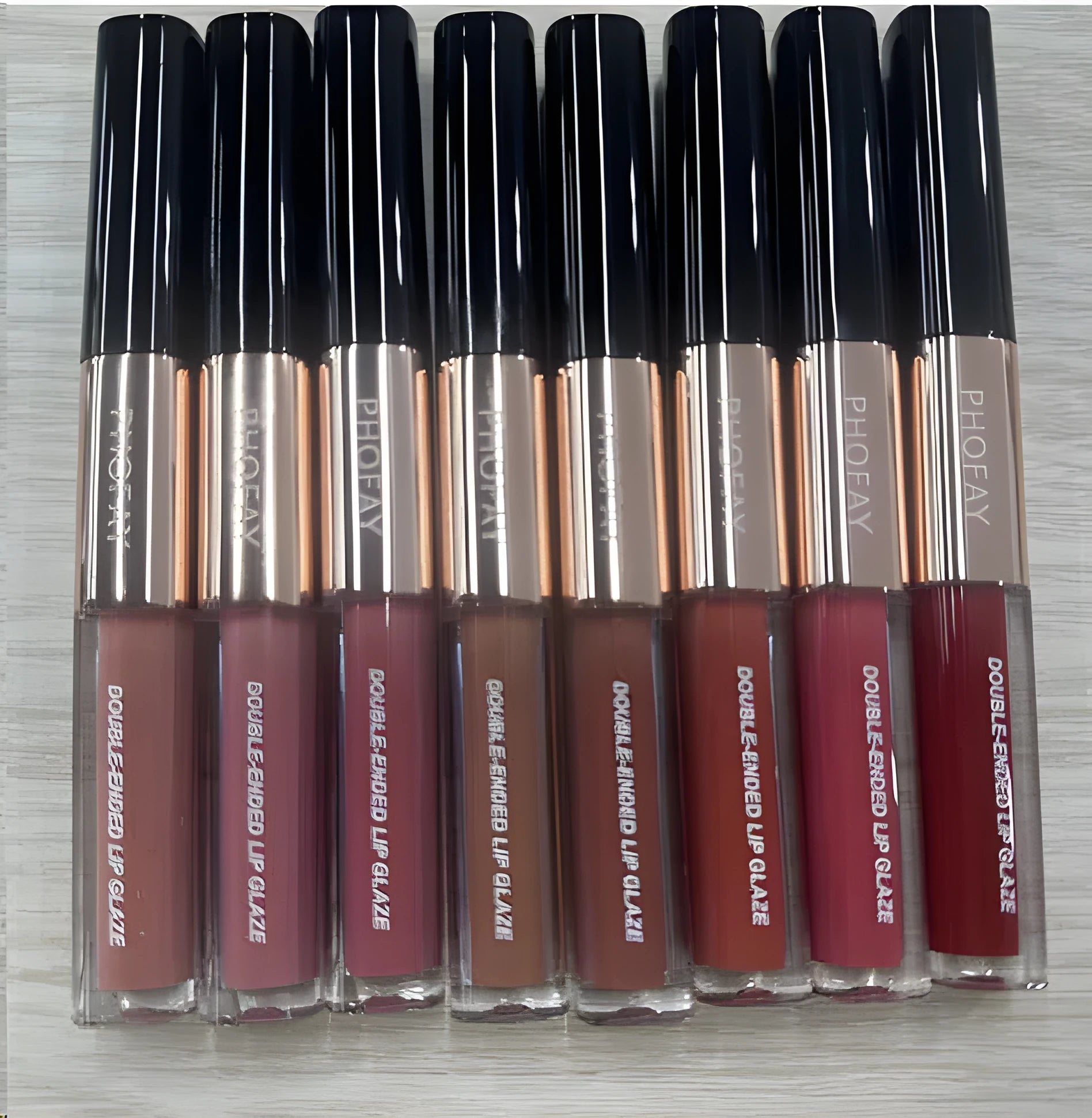 C-L021 double-head non-stick cup lip gloss showing two applicator tips and available in 8 colour shades.