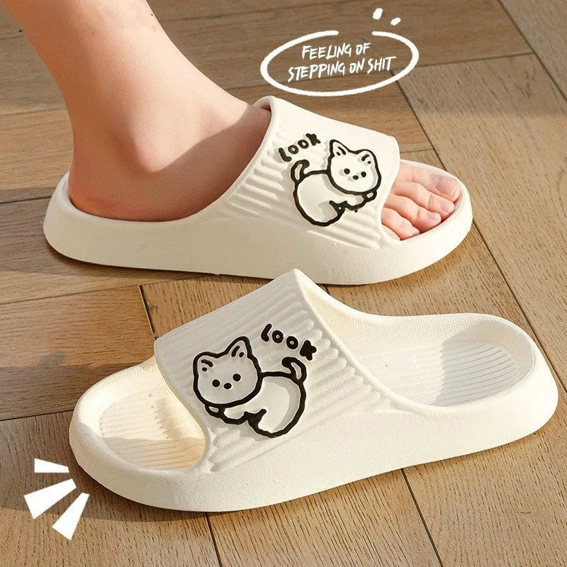 Women's green cat slippers with thick platform sole and flip-flop design.