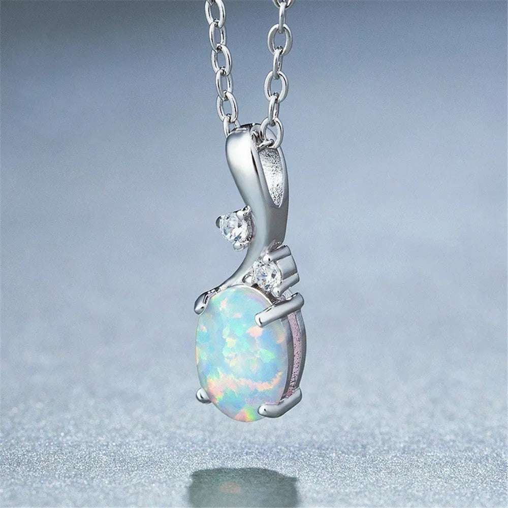Water drop shaped opal pendant necklace with adjustable chain in rose gold or white finish