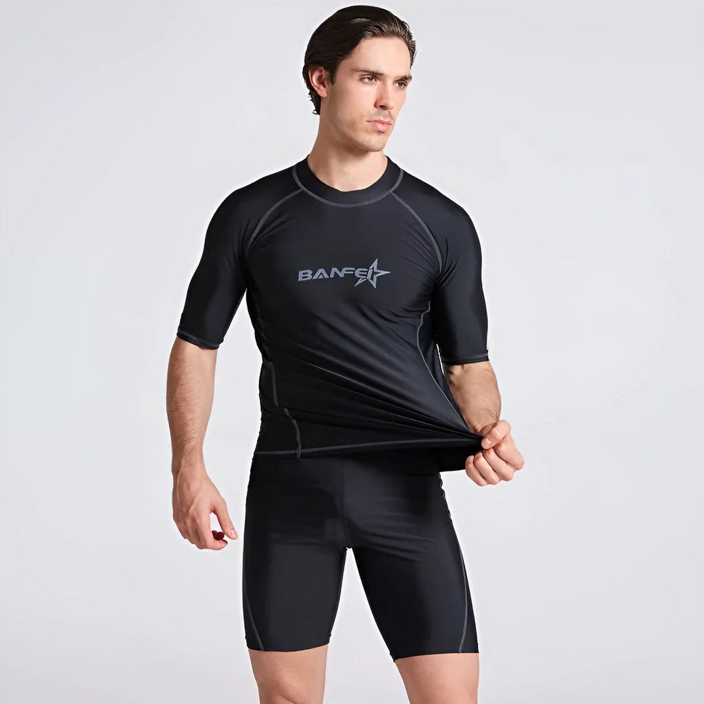 Men's quick-drying half sleeve swim top and pant set in nylon fabric on a white background.