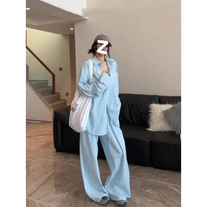 Women's blue shirt and wide-leg pants suit with flight sleeve and button stitching details