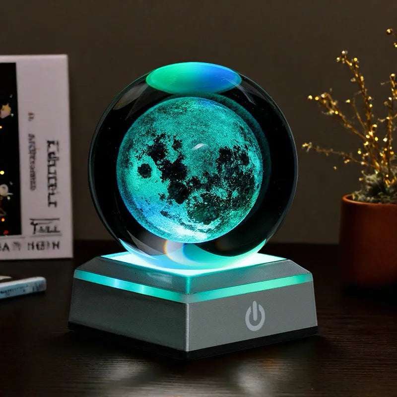 Transparent white crystal ball night light with 3D inner carving of Milky Way on black square colourful base