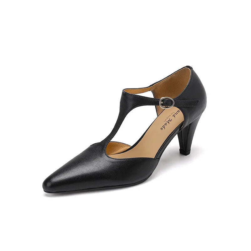 Brown retro women's T-strap sandals with a closed toe, buckle fastening, and a short stout heel.