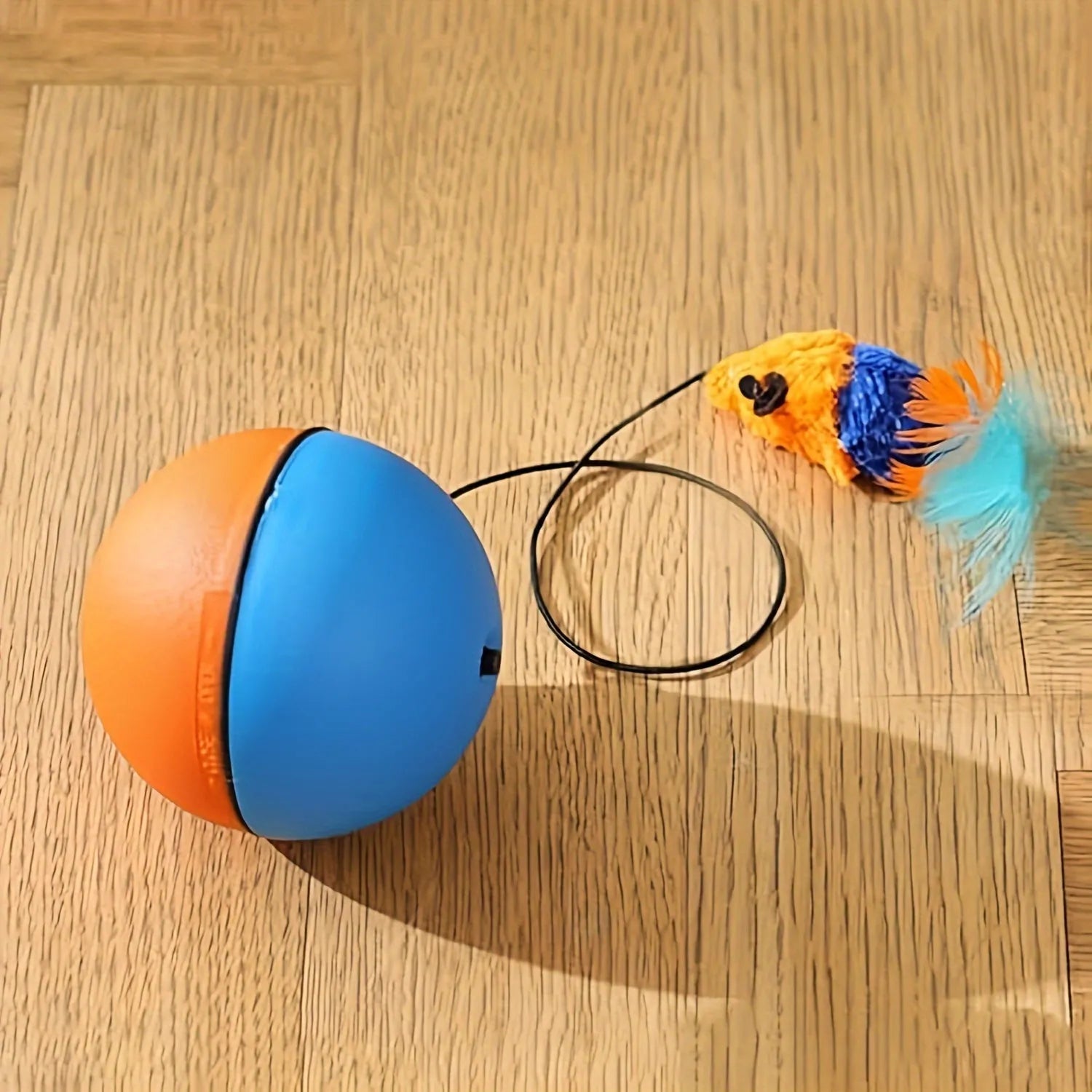 Interactive cat toy ball with plush mouse attachment in blue and orange colours