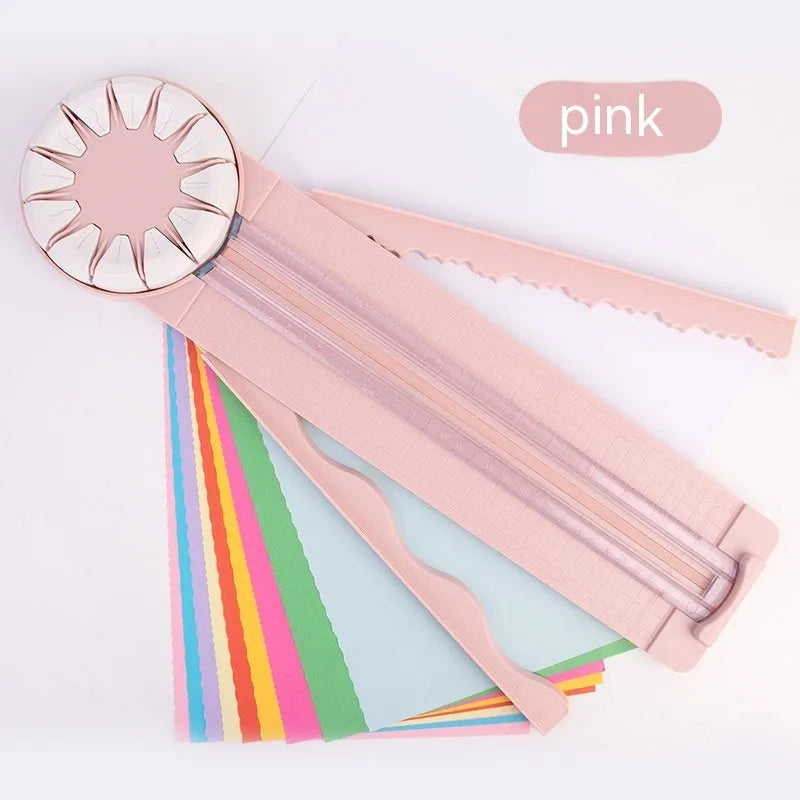 12-in-1 plastic paper cutting machine in pink colour on white background