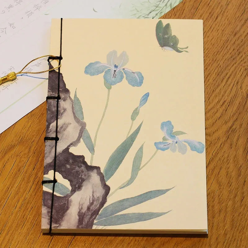 A5 antique thread-bound notebook with embossed cover and decorative tassels