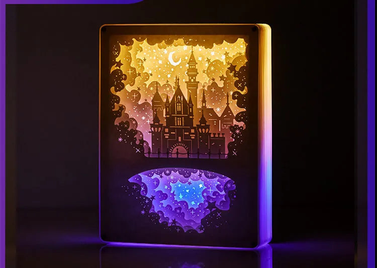 Three-dimensional paper carving USB night light with remote control on bedside table