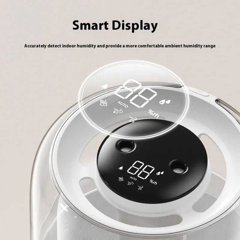 Beige round USB humidifier with dual spray nozzles and digital humidity display on a desk