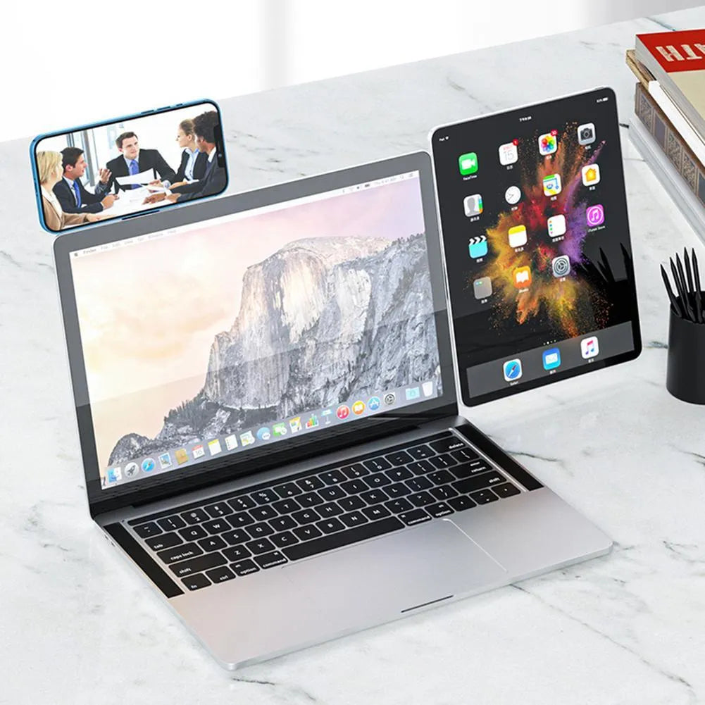 Black aluminium laptop phone holder with magnetic mount attached to a laptop screen.