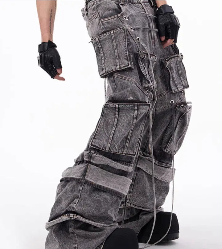 Grey distressed denim men's overalls with rope stitching and mop pant leg style