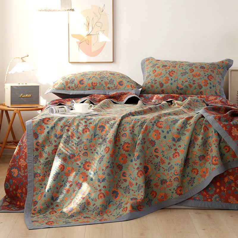 Cotton gauze three-piece blanket set with floral pattern and matching pillowcases for bed