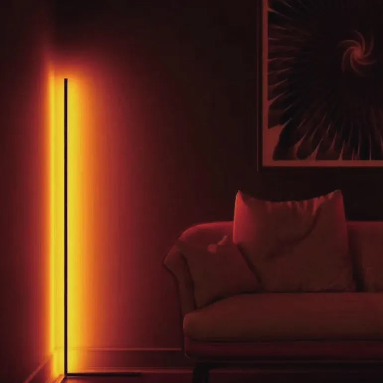 Black smart RGB floor lamp with aluminium alloy body and silicone shade, shown with remote control