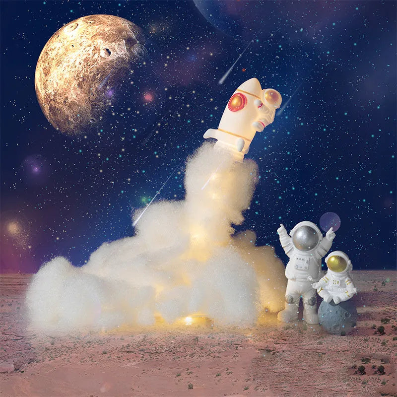 DIY astronaut rocket night light kit with warm LED string lights, plastic chassis, and straws for assembly.