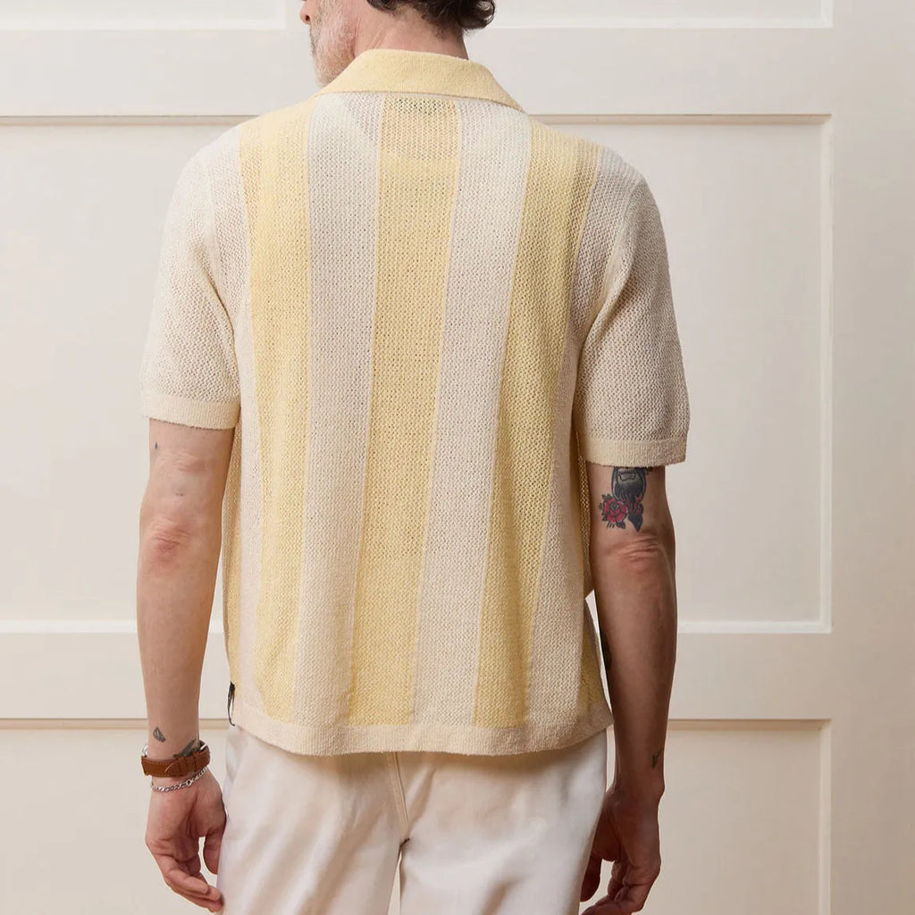 Yellow women's short-sleeved polo shirt with hollow-out asymmetric design, made from Tencel fabric.