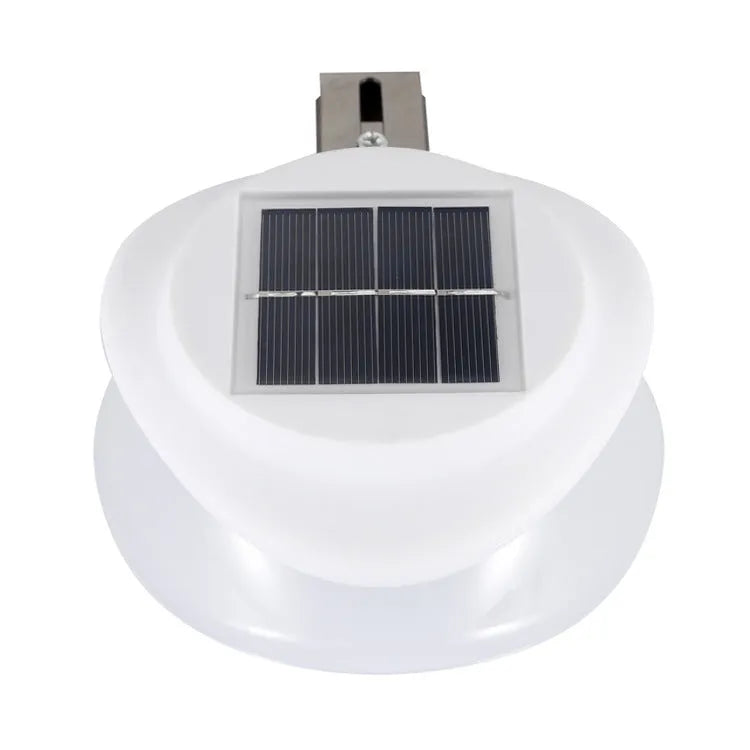 Solar-powered outdoor fence wall lamp in garden setting with 9 LED illumination