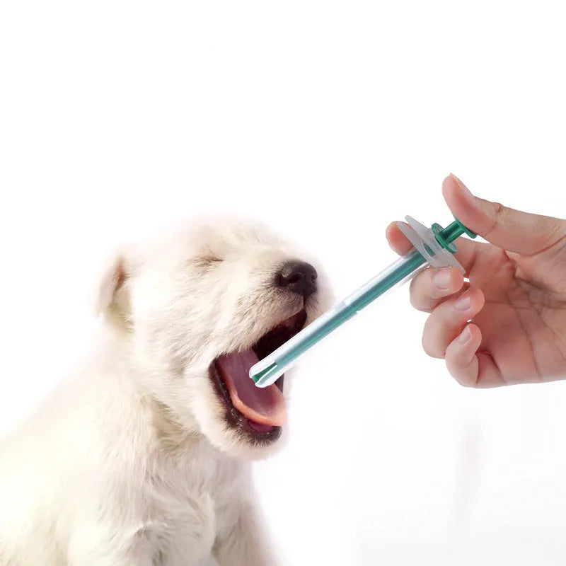 Two pet pill shooters with soft tip syringes for administering tablets to cats and dogs