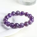Natural feather amethyst crystal bracelet with scattered Snow Mountain purple beads and Ruyi detail.