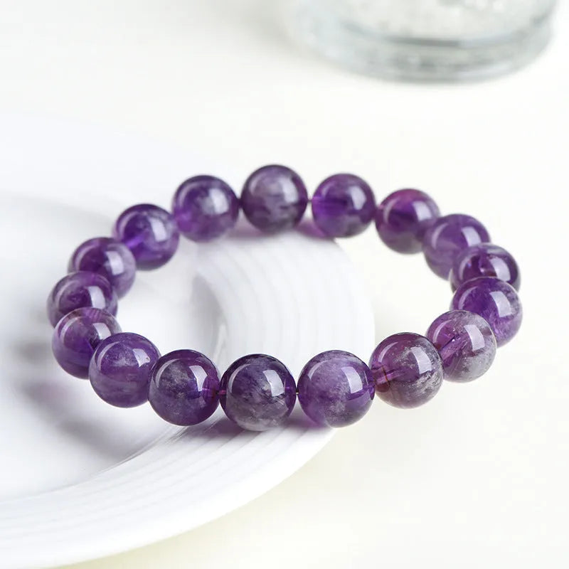 Natural feather amethyst crystal bracelet with scattered Snow Mountain purple beads and Ruyi detail.