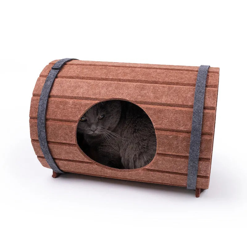 Assembled wine barrel shaped cat bed made from three grey polyester felt panels with binding straps.