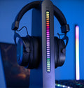 Xuanjing Player H6 Black wired gaming headset with 50MM driver and USB connection on a desk