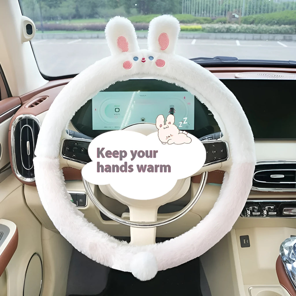 Plush rabbit fur steering wheel cover with embroidered cartoon design, shown fitted on a 38cm wheel.